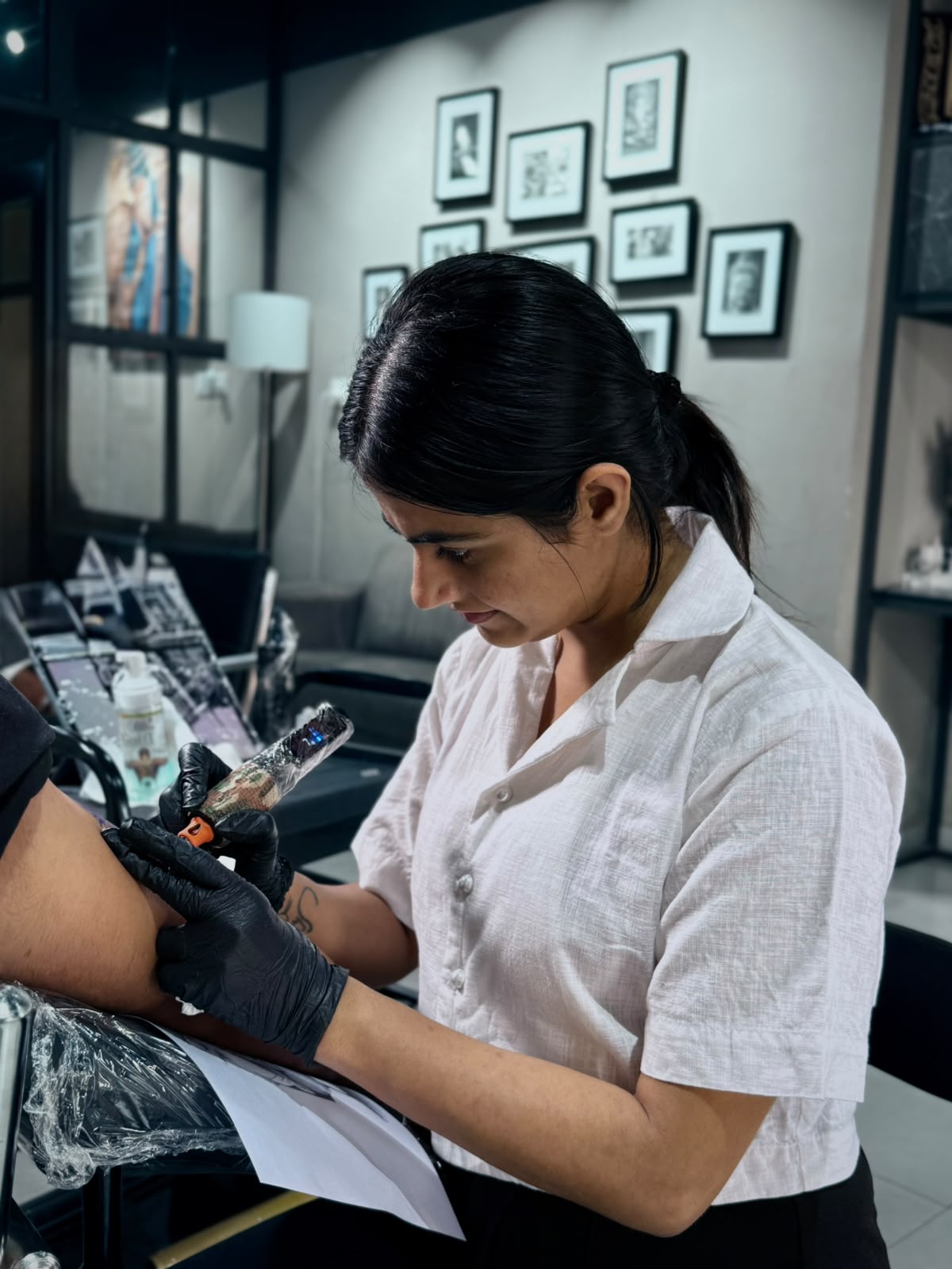 Shagun tattooing in the studio